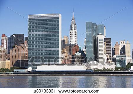 USA, New York City, Skyline against blue sky View Large Photo Image Stock Image - USA, New York City, Skyline against blue sky. Fotosearch