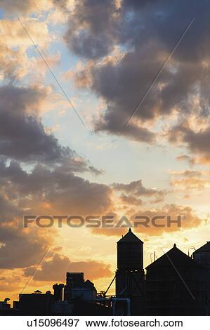 Stock Photo - USA, New York City skyline under moody sky. Fotosearch