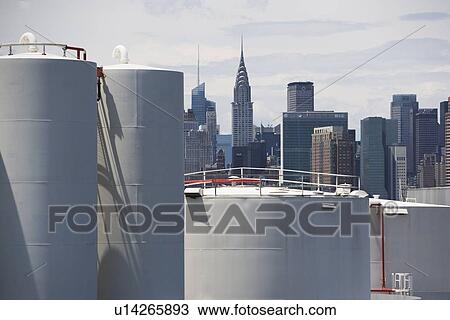 USA, New York, Industrial area and city skyline View Large Photo Image Stock Image - USA, New York, Industrial area and city skyline. Fotosearch