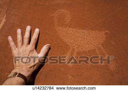 Picture - USA, Utah, Native American art on stone wall. Fotosearch