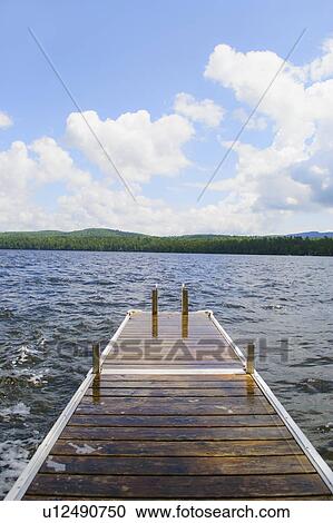 View of lake with wooden jetty View Large Photo Image Stock Image - View of lake with wooden jetty. Fotosearch