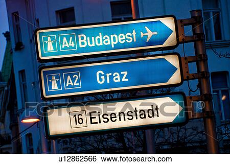 View of road signs at dusk View Large Photo Image Stock Photograph - View of road signs at dusk. Fotosearch
