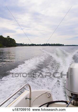 Stock Photograph - Wake made motorboat. Fotosearch