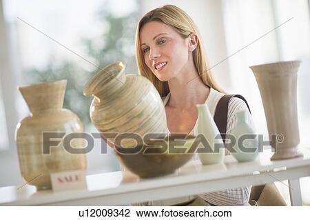 Woman buying pottery View Large Photo Image Stock Image - Woman buying pottery. Fotosearch