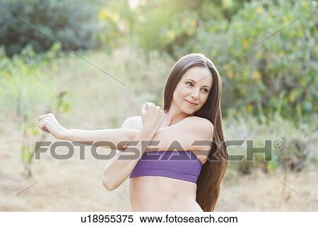 Woman exercising in park View Large Photo Image Stock Photography - Woman exercising in park. Fotosearch