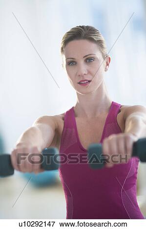 Stock Photo - Woman exercising. Fotosearch