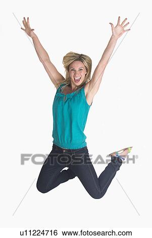 Woman jumping on white background View Large Photo Image Stock Photograph - Woman jumping on white background. Fotosearch