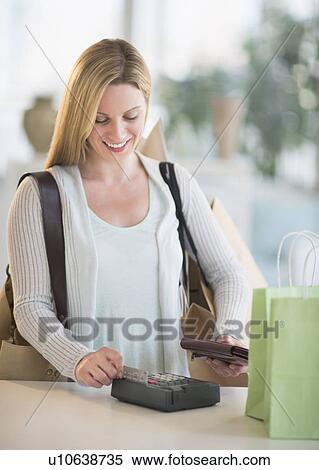 Woman paying with credit card View Large Photo Image Stock Photography - Woman paying with credit card. Fotosearch