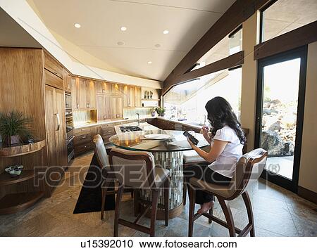 Woman reading in home interior View Large Photo Image Stock Image - Woman reading in home interior. Fotosearch