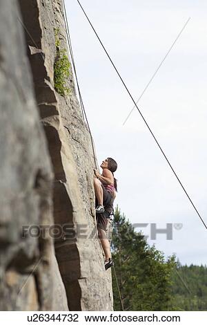 Woman rock climbing View Large Photo Image Stock Image - Woman rock climbing. Fotosearch