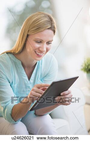 Woman using tablet pc View Large Photo Image Stock Image - Woman using tablet pc. Fotosearch