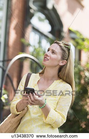 Woman walking in street View Large Photo Image Stock Image - Woman walking in street. Fotosearch