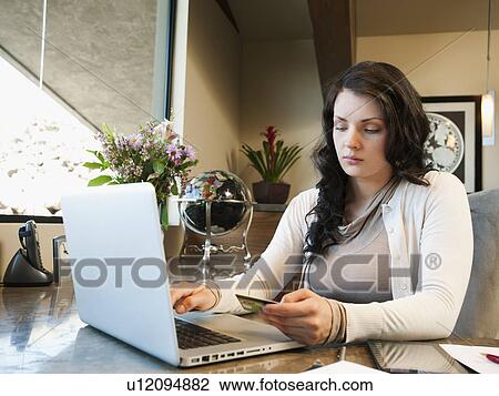Woman working from home View Large Photo Image Stock Image - Woman working from home. Fotosearch