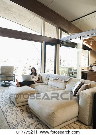 Stock Image - Woman working from home. Fotosearch