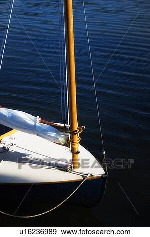 Yacht with furled sail View Large Photo Image Stock Photo - Yacht with furled sail. Fotosearch