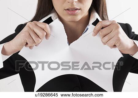 Young businesswoman tearing paper, close-up View Large Photo Image Stock Photography - Young businesswoman tearing paper, close-up. Fotosearch