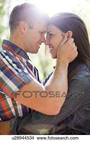 Picture - Young couple looking at each other. Fotosearch