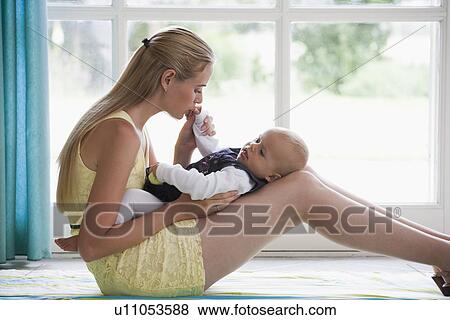 Young mother with daughter playing View Large Photo Image Stock Photo - Young mother with daughter playing. Fotosearch