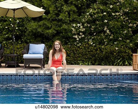 Stock Photo - Young woman at swimming pool. Fotosearch