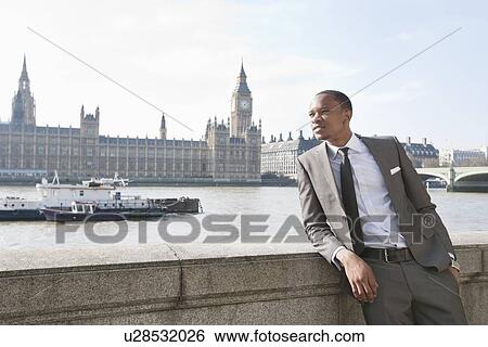 African American businessman leaning with hand in pocket View Large Photo Image Stock Photograph - African American businessman leaning with hand in pocket. Fotosearch