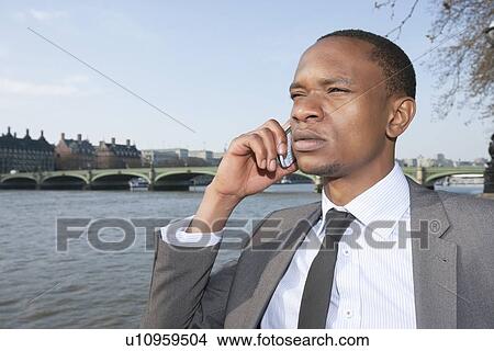 African American businessman on a call View Large Photo Image Picture - African American businessman on a call. Fotosearch