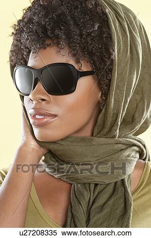 African American woman wearing sunglasses with stole over her head View Large Photo Image Stock Photography - African American woman wearing sunglasses with stole over her head. Fotosearch