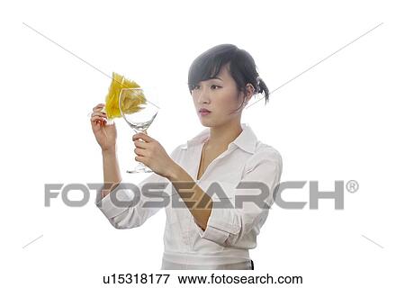 Asian house cleaner cleaning glass with backlit over white background View Large Photo Image Stock Photo - Asian house cleaner cleaning glass with backlit over white background. Fotosearch