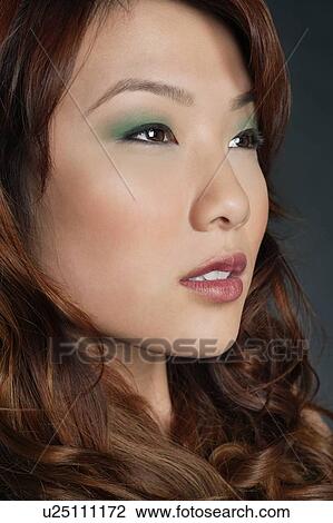 Beautiful Chinese woman with makeup looking away View Large Photo Image Stock Image - Beautiful Chinese woman with makeup looking away. Fotosearch