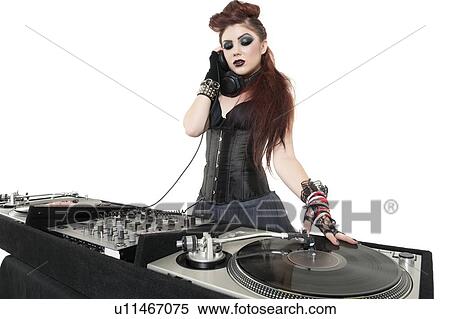 Stock Photography - Beautiful punk DJ over white background. Fotosearch