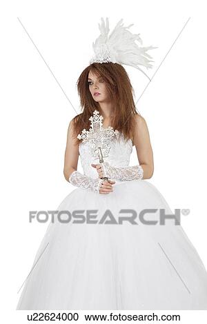 Beautiful woman in wedding dress holding crucifix over white background View Large Photo Image Stock Image - Beautiful woman in wedding dress holding crucifix over white background. Fotosearch