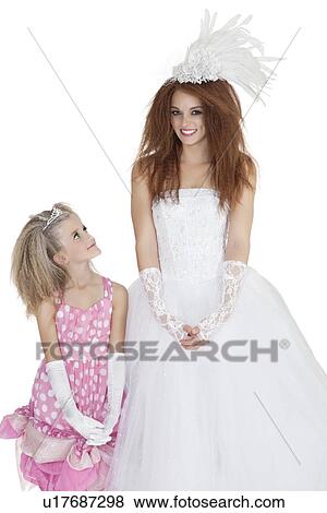 Beautiful young bride with bridesmaid over white background View Large Photo Image Stock Photo - Beautiful young bride with bridesmaid over white background. Fotosearch
