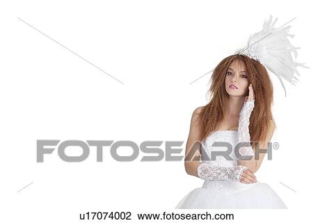 Beautiful young brunette in wedding gown looking away over white background View Large Photo Image Stock Image - Beautiful young brunette in wedding gown looking away over white background. Fotosearch