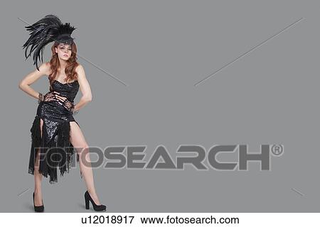 Beautiful young brunette posing over gray background View Large Photo Image Stock Photo - Beautiful young brunette posing over gray background. Fotosearch