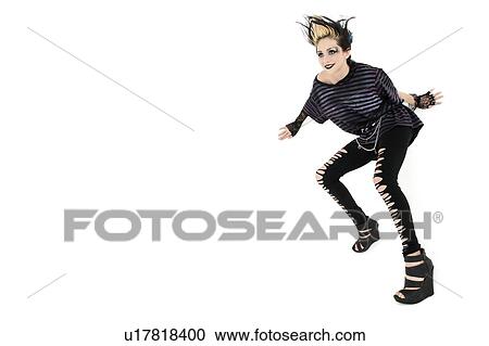 Stock Image - Beautiful young woman posing over white background. Fotosearch