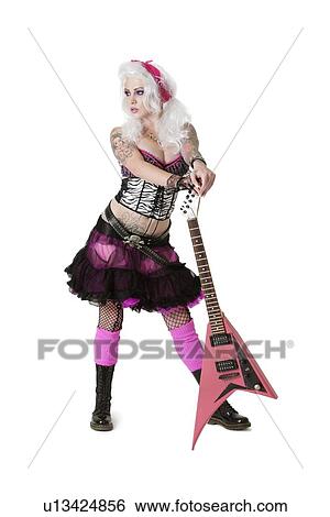 Beautiful young woman standing with guitar while looking away over white background View Large Photo Image Stock Photograph - Beautiful young woman standing with guitar while looking away over white background. Fotosearch