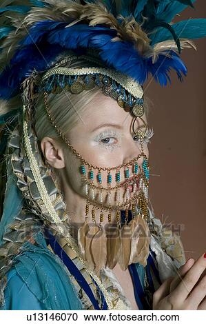Beautiful young woman wearing jewelry on face View Large Photo Image Stock Image - Beautiful young woman wearing jewelry on face. Fotosearch