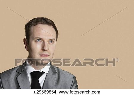 Picture - Close-up of a young businessman looking away. Fotosearch