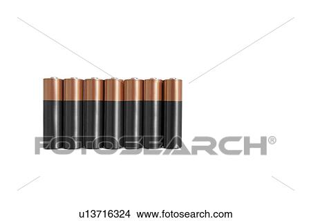 Close-up of batteries in a row over white background View Large Photo Image Picture - Close-up of batteries in a row over white background. Fotosearch