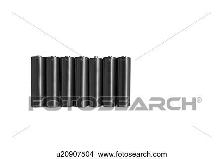 Picture - Close-up of black batteries over white background. Fotosearch