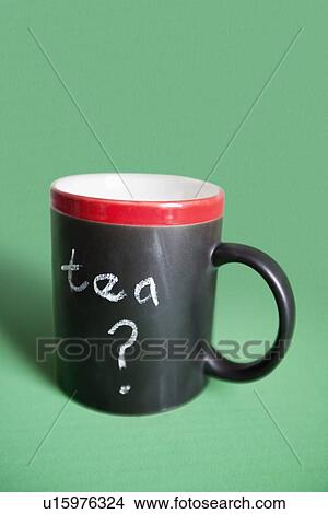 Close-up of coffee mug with text over colored background View Large Photo Image Picture - Close-up of coffee mug with text over colored background. Fotosearch