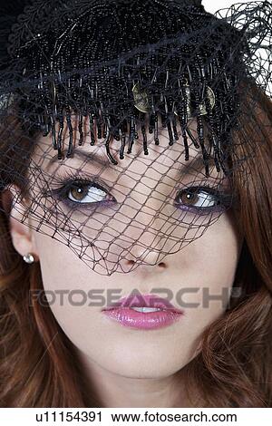 Close-up of elegant woman wearing veil View Large Photo Image Stock Image - Close-up of elegant woman wearing veil. Fotosearch