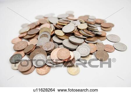 Close-up of large group of coins over white background View Large Photo Image Picture - Close-up of large group of coins over white background. Fotosearch