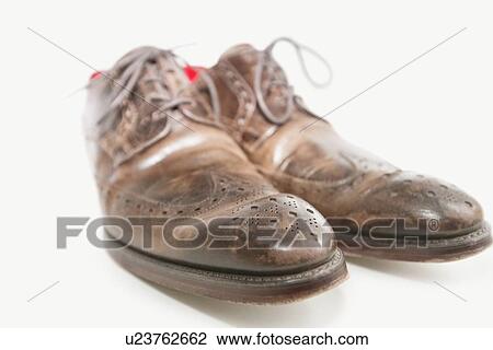 Close-up of men's leather shoe over white background View Large Photo Image Stock Image - Close-up of men's leather shoe over white background. Fotosearch