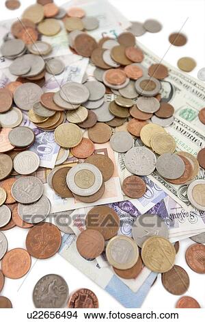 Picture - Close-up of paper currencies and coins. Fotosearch