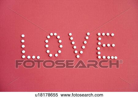 Close-up of push pins spelling love over colored background View Large Photo Image Stock Photography - Close-up of push pins spelling love over colored background. Fotosearch
