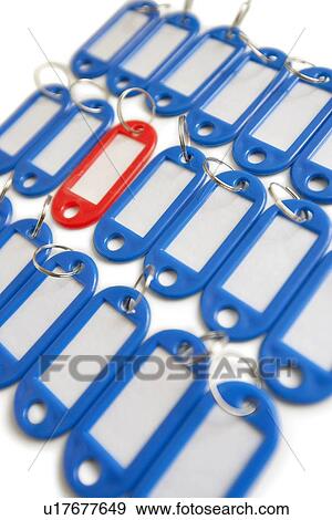 Close-up of red surrounded with blue key ring tags View Large Photo Image Stock Photo - Close-up of red surrounded with blue key ring tags. Fotosearch