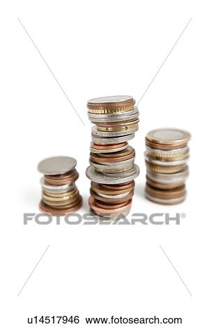 Close-up of stack of coins balancing over white background View Large Photo Image Stock Photograph - Close-up of stack of coins balancing over white background. Fotosearch