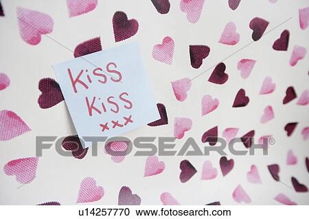 Close-up of sticky note with a message over heart shaped background View Large Photo Image Stock Image - Close-up of sticky note with a message over heart shaped background. Fotosearch