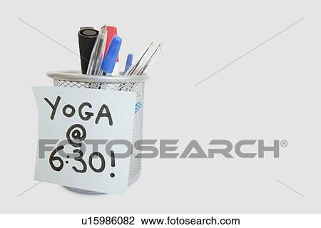 Close-up of sticky note with yoga message on pen holder over white background View Large Photo Image Stock Image - Close-up of sticky note with yoga message on pen holder over white background. Fotosearch