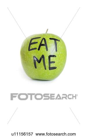Stock Photo - Close-up of text on a granny smith apple reading eat me over white background. Fotosearch